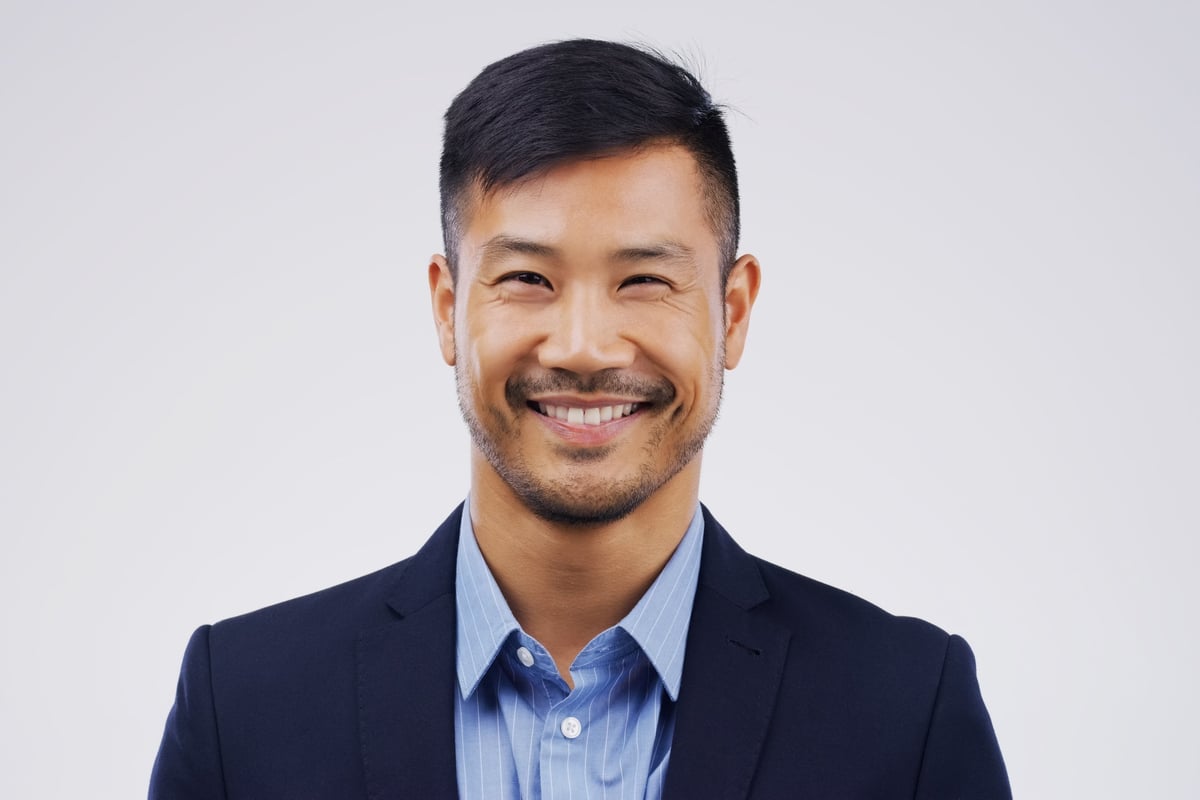 Studio portrait of a businessman against grey background