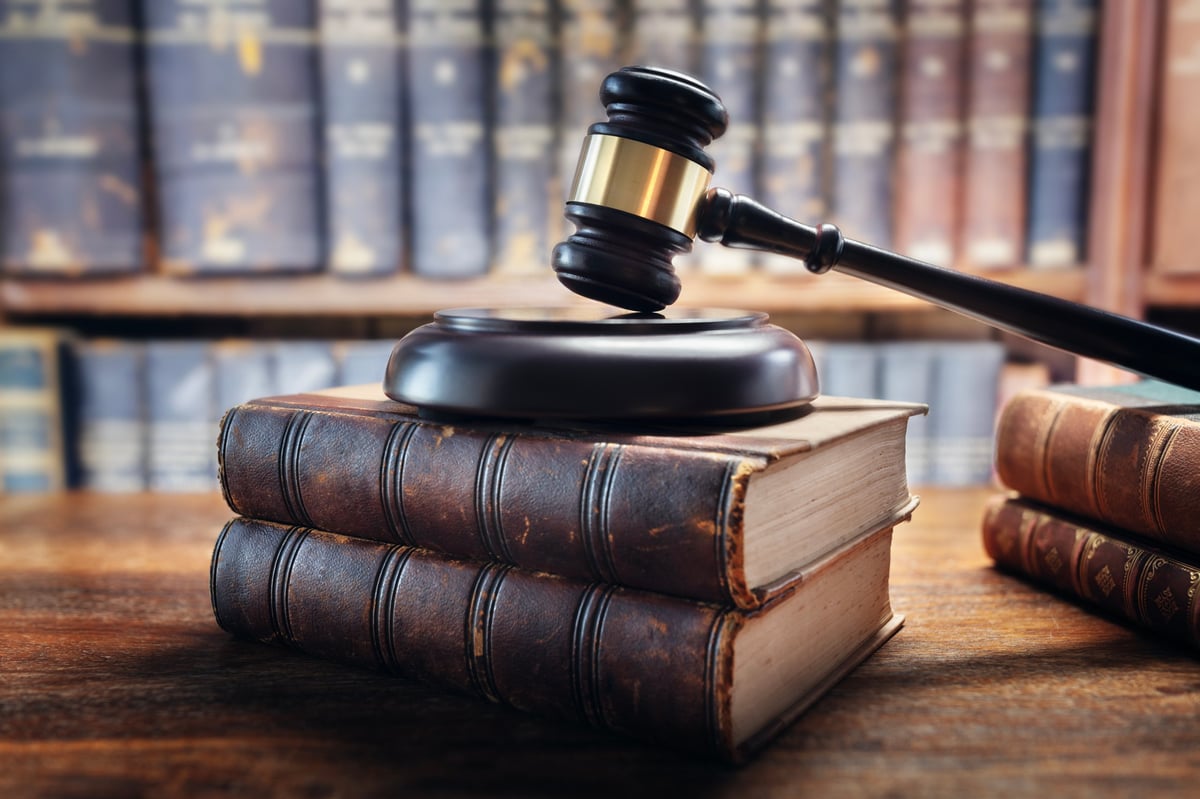 Judge gavel and law books in court