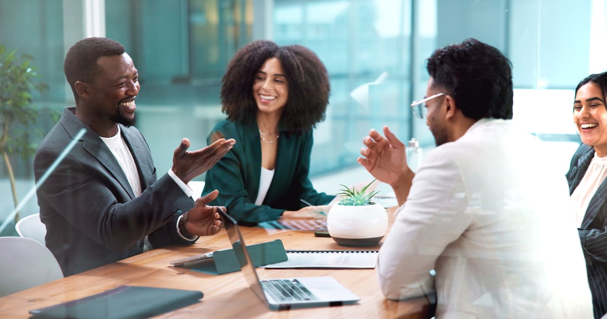 Laugh, laptop and business people in meeting in office for collaboration with finance budget planning. Discussion, corporate and financial managers with review for investment proposal in workplace.